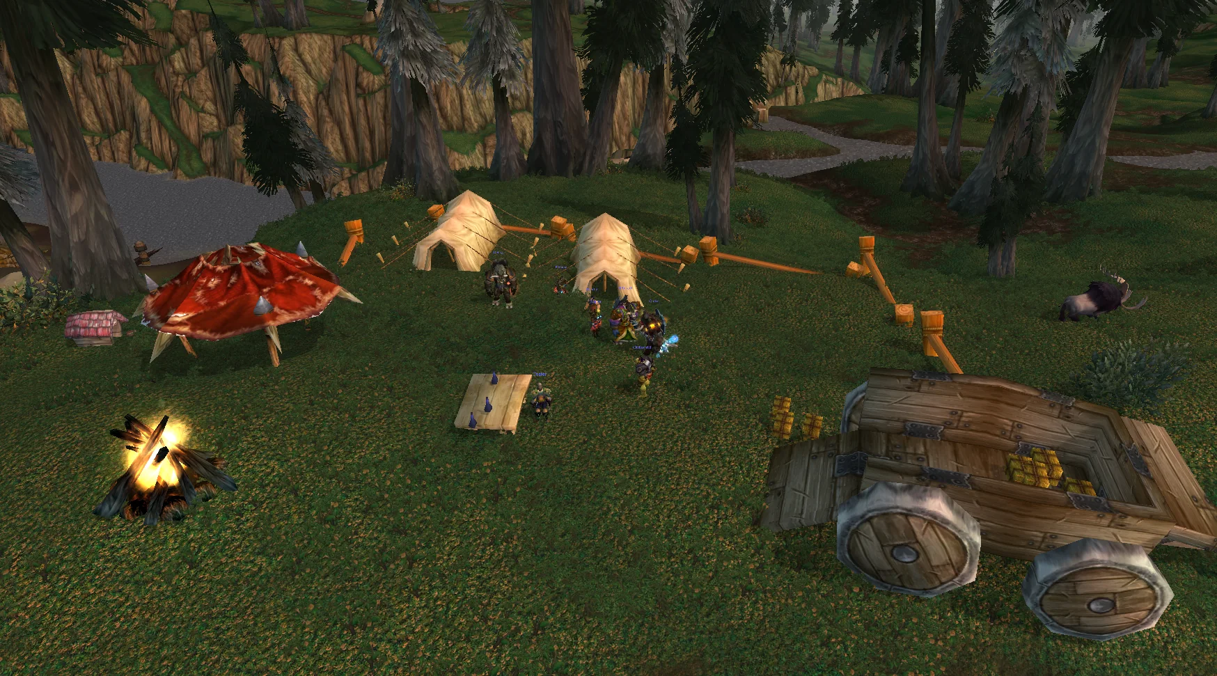 A furnished Warband Camp in Howling Fjord with tents, a campfire and buildings, alts strolling around it